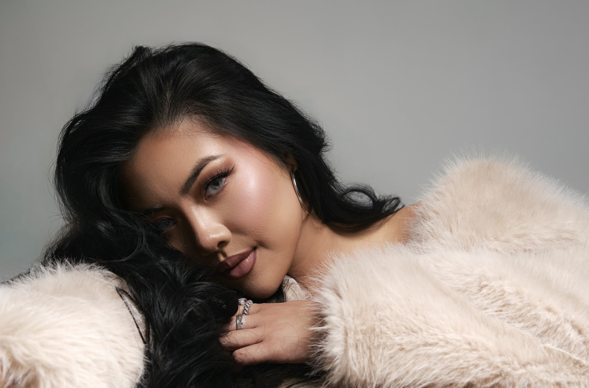 Vivian True in a fur coat, studio close-up portrait